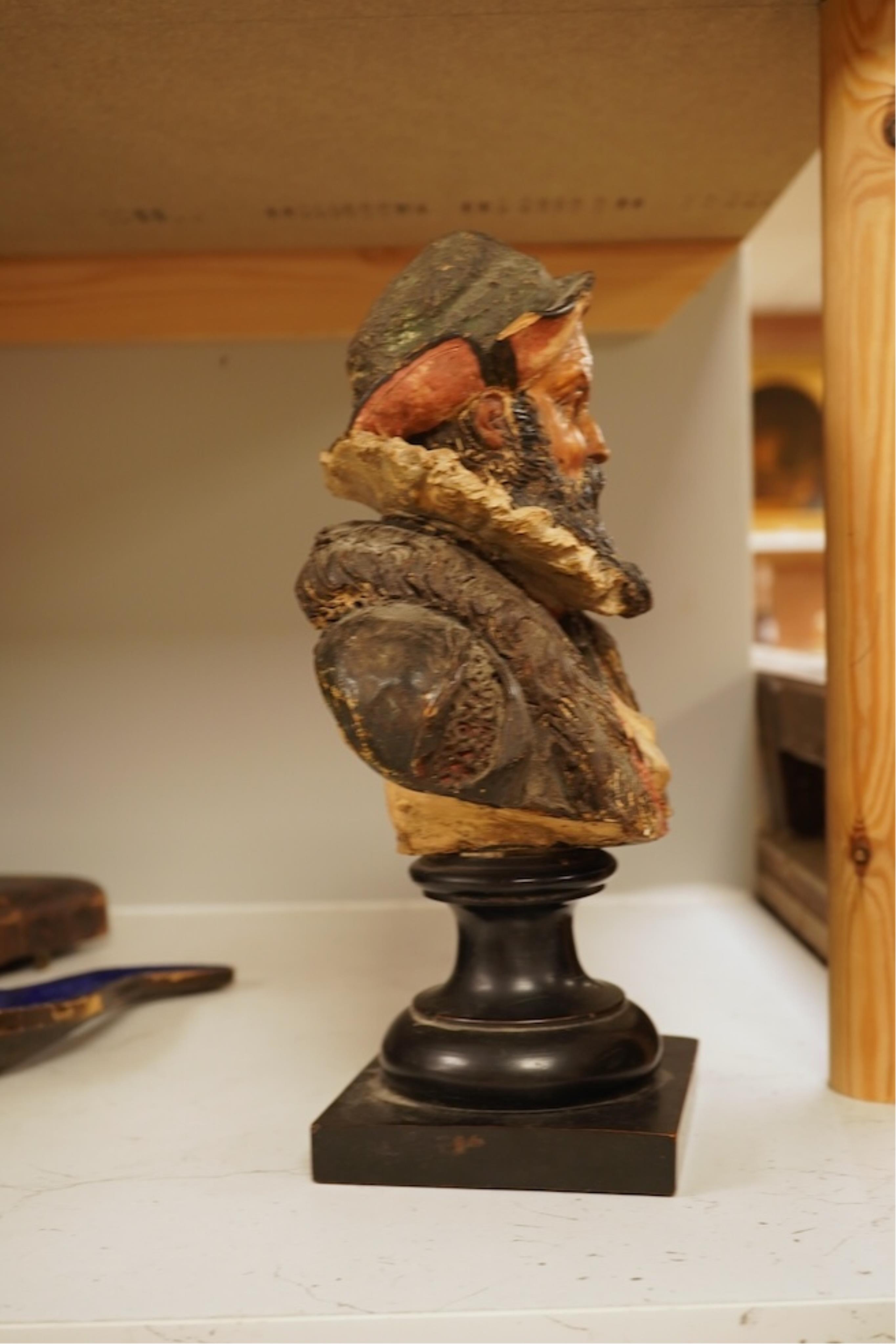 A 19th century German cold-painted terracotta bust, on ebonised socle and a Meerschaum pipe in case, bust 27cm high